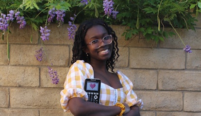 Sofia Ongele holds a graphic calculator. 