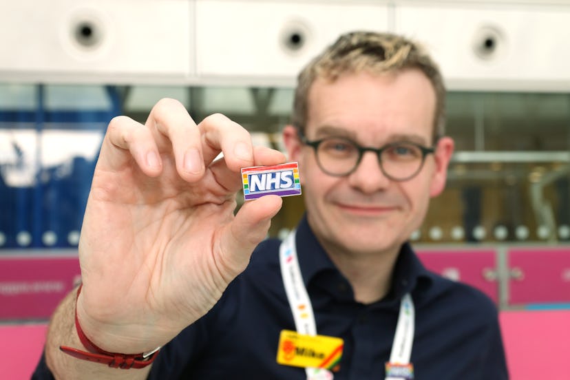 Dr Mike Farquhar pictured with the NHS rainbow badge
