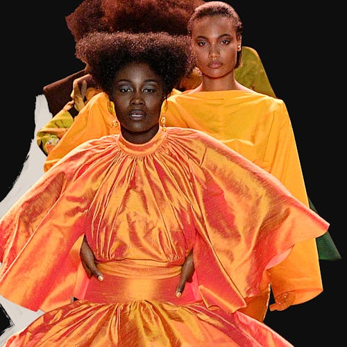 Models wearing orange outfits walking on a runway during digital fashion week