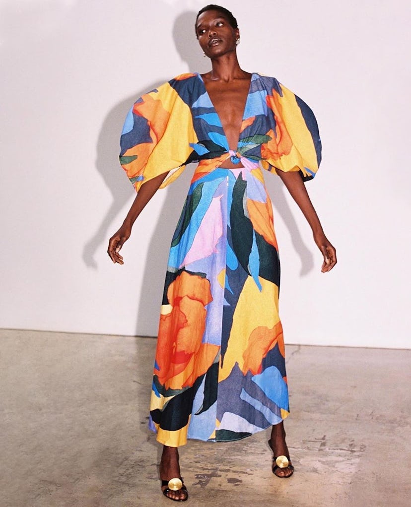 A model with a short haircut wearing Mara Hoffman Leila Dress