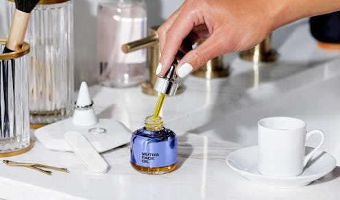 MUTHA Face Oil on counter.