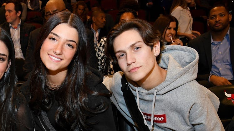 Chase Hudson and Charli D'Amelio attend a basketball game.