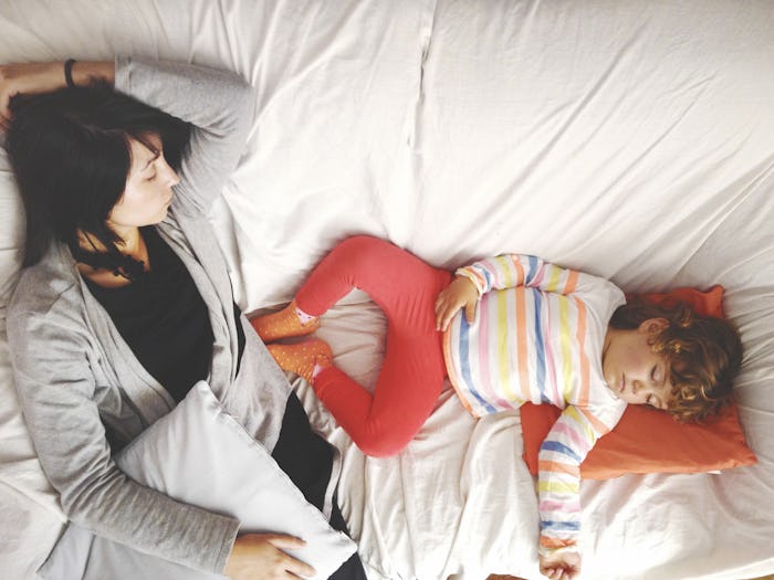 Mother and child on a sofa, snoozing 