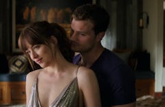 Dakota Johnson as Anastasia Steele and Jamie Dornan as Christian Grey in the 'Fifty Shades of Grey' ...