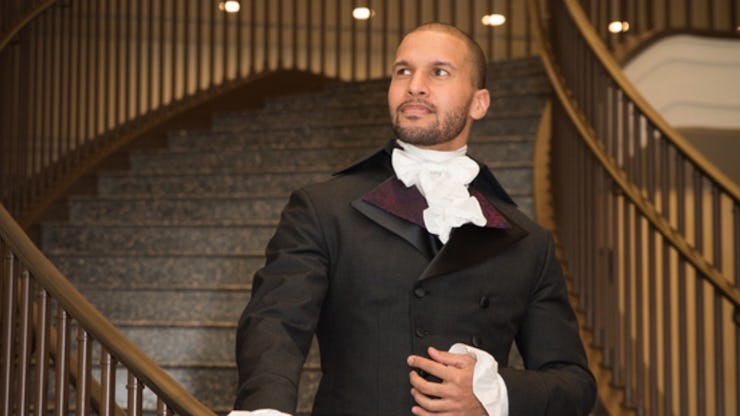 Hamilton star Sydney James Harcourt walking down brown-grey stairs in costume