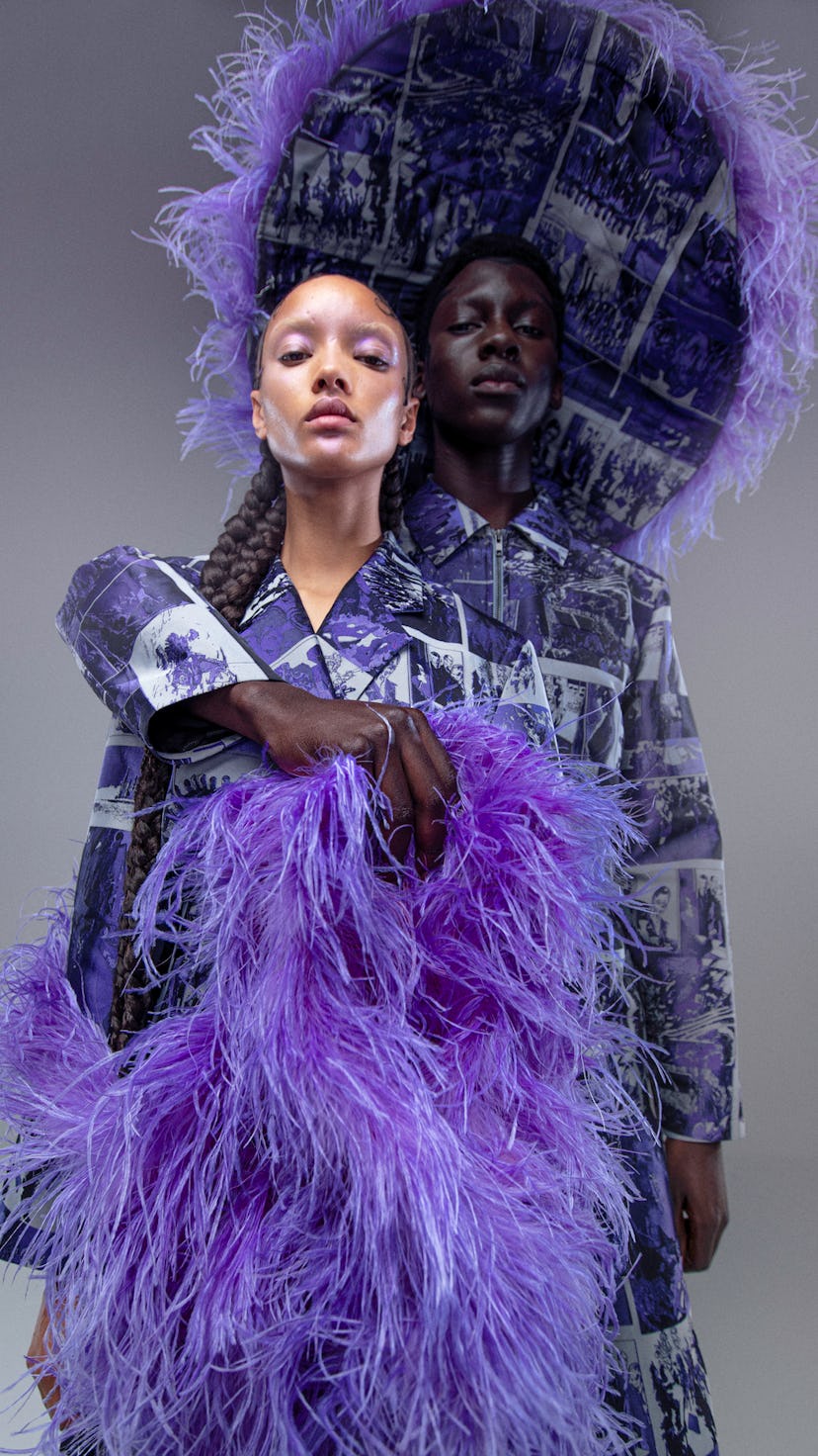 Male and female models pose in lavender suits.