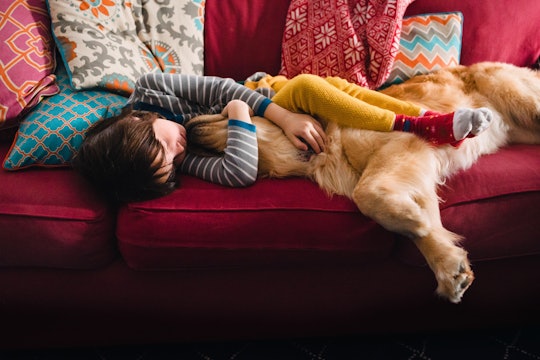 girl and dog on couch