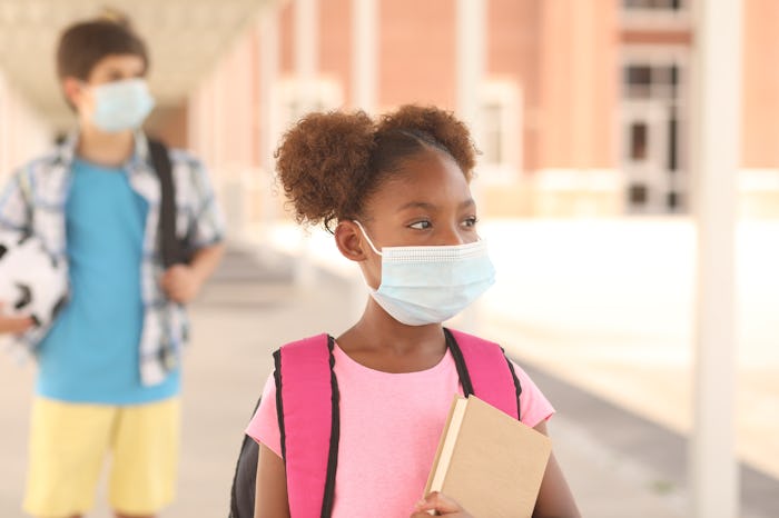 kids walking into school with face masks
