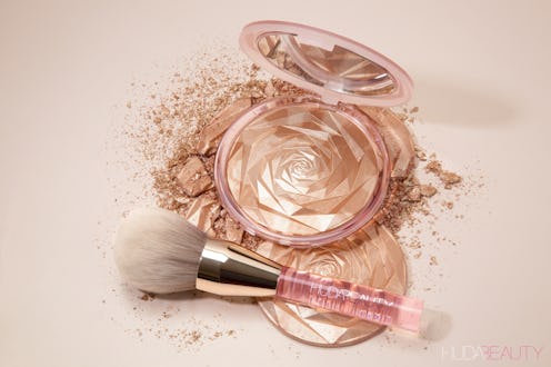 The new Huda Beauty highlighter is meant for your body and comes in a large compact.