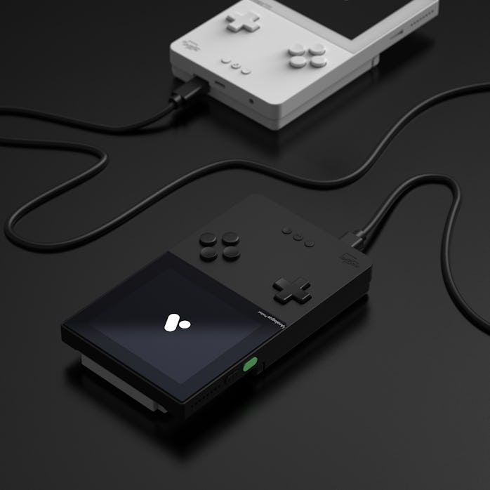 Two Pocket consoles connected via cable.