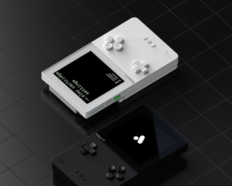 A black Pocket console and a white Pocket console sit side-by-side.