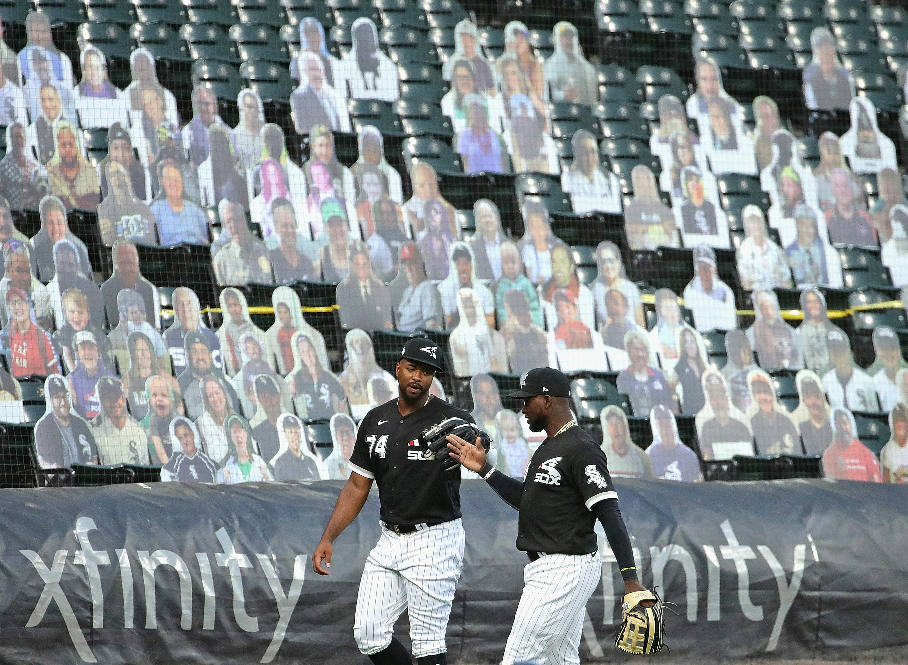 Pictures of fans on a stand during a baseball match during Covid-19