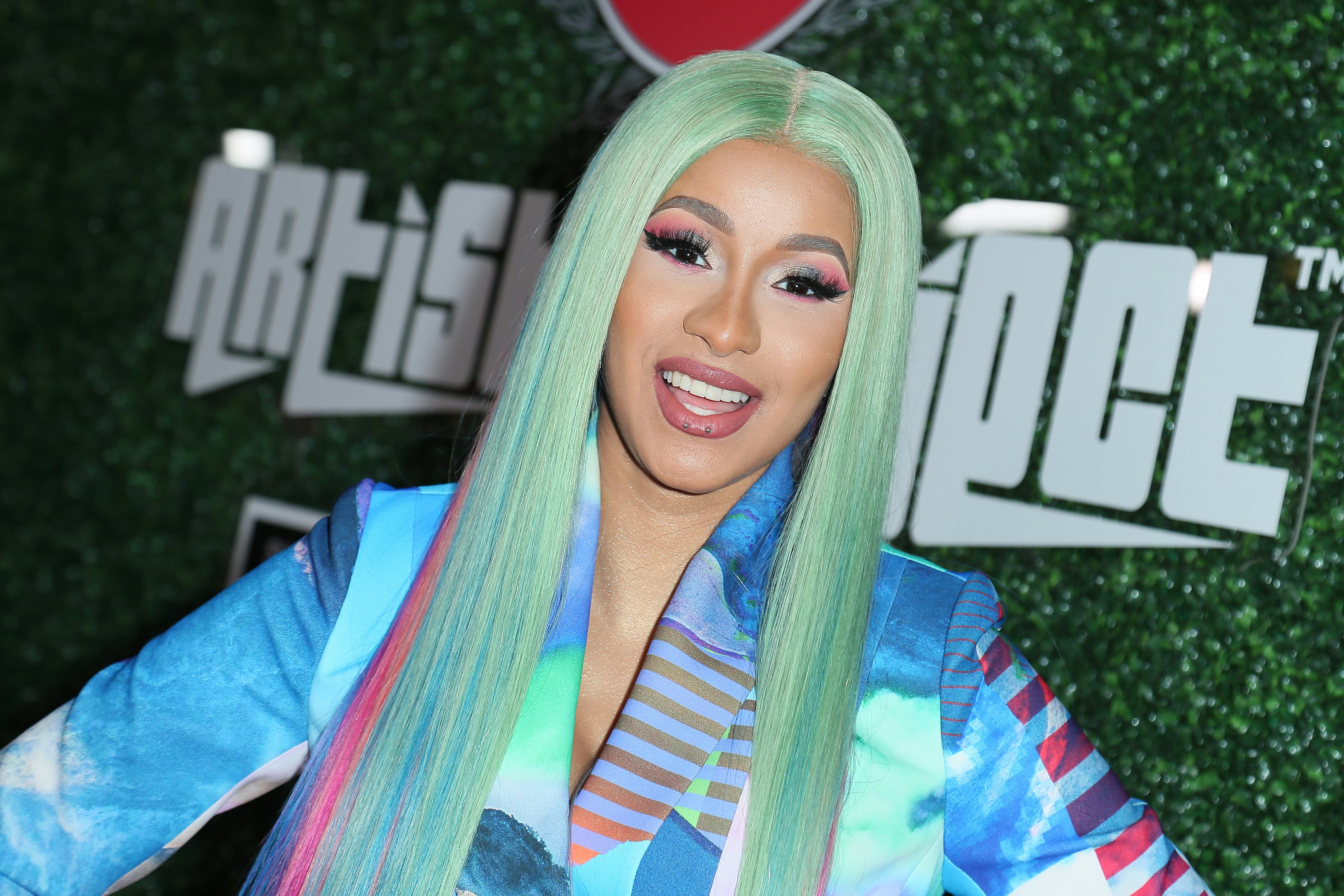 Cardi Bs Bbs Squashed In A FigureHugging Fishnet Minidress Is Giving A  Full Display Of Her Curves This NSFW Look Leaves Nothing to the  Imagination