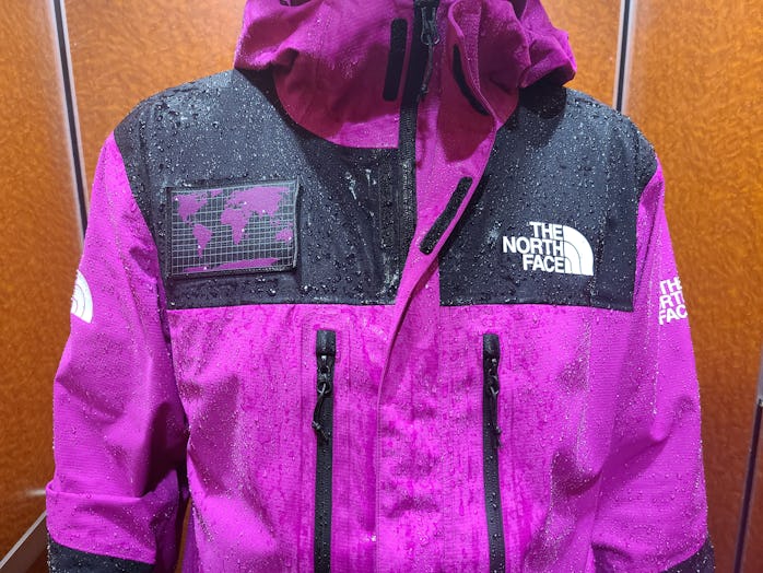 A close-up of a wet jacket after a rainstorm.