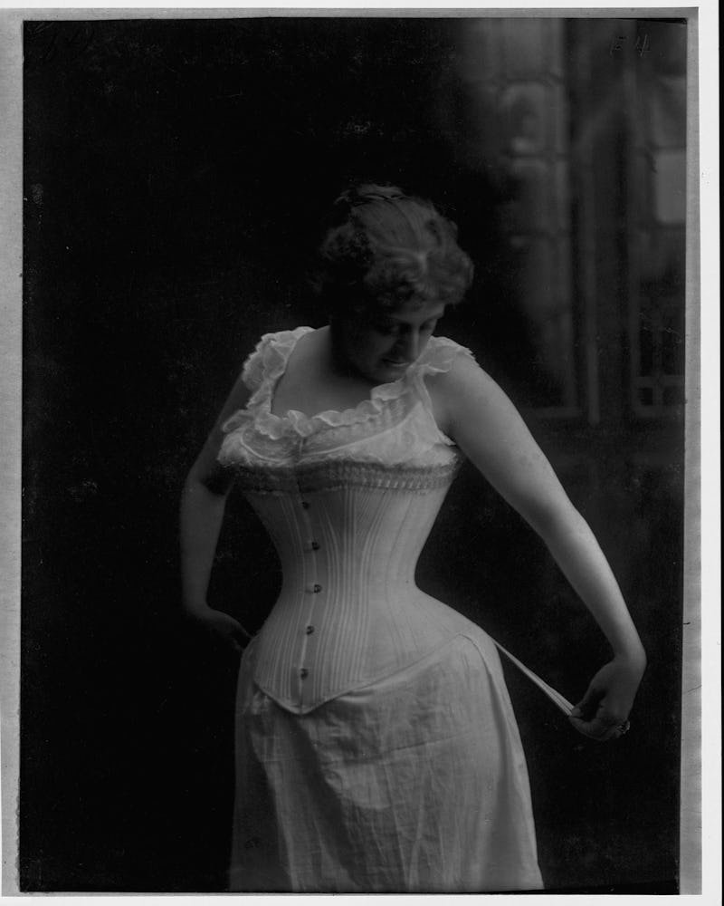 Black and white drawing of a woman wearing a white corset dress