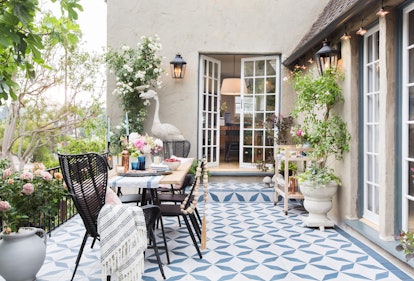 Pillows, throws, and lighting are all easy ways to refresh your patio for summer