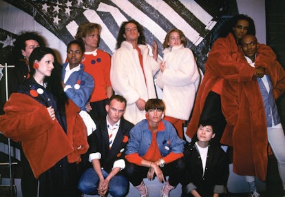 Eleven people posing while wearing clothes in red, white, black and denim segments