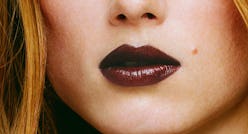 Dark lipstick on lips of a blonde girl