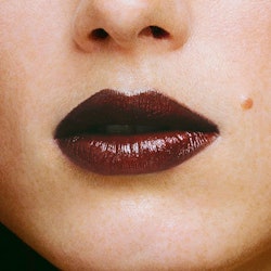 Dark lipstick on lips of a blonde girl