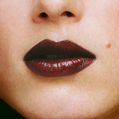 Dark lipstick on lips of a blonde girl