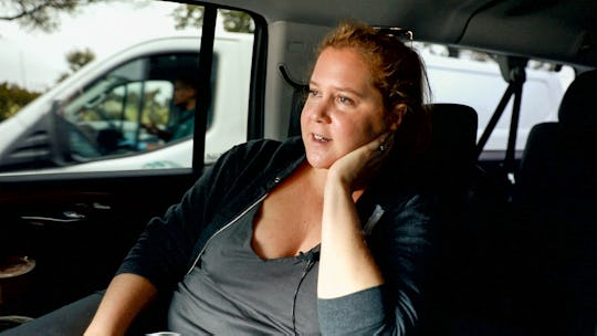 A pregnant Amy Schumer rides in a car in her new documentary 'Expecting Amy'