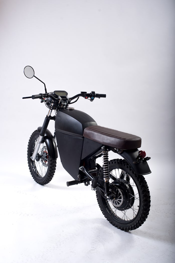 Studio shot of the BlackTea electric moped three-quarter view