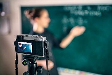 A teacher filming an online lecture video