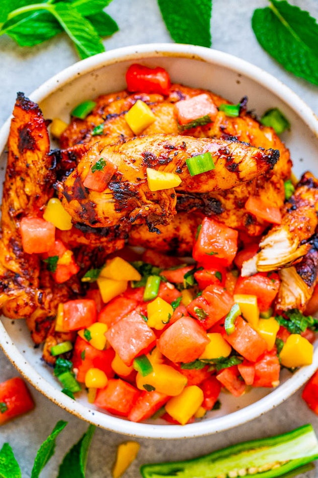 Grilled Chicken with Watermelon Mango Mint Salsa is the perfect dinner recipe to use up your waterme...