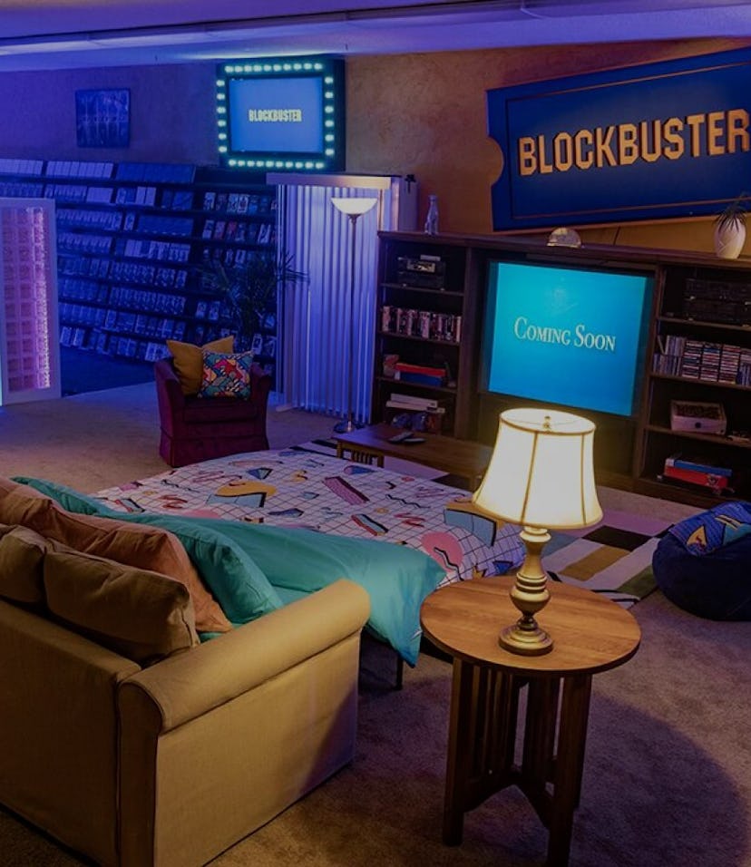 A '90s era living room built in a Blockbuster store.