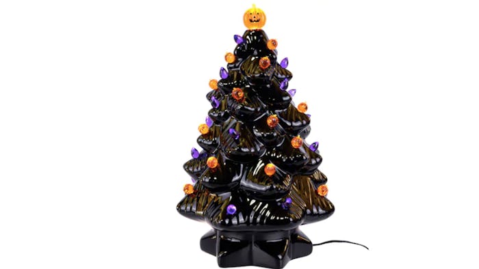 Black ceramic "Halloween" tree with orange and purple light bulbs and a lit up pumpkin on top