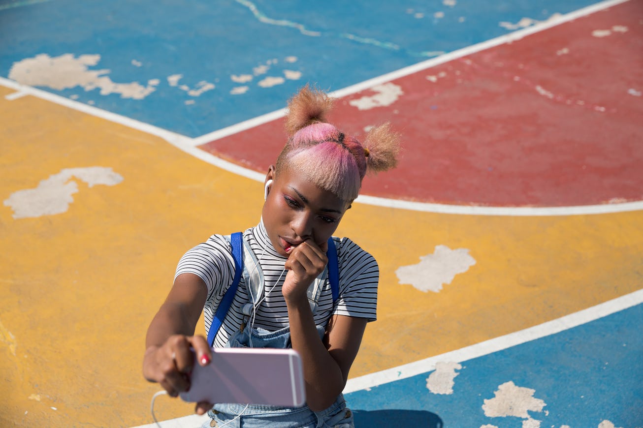 A girl wearing an outfit inspired by the 'Alt girl' TikTok fashion aesthetic.