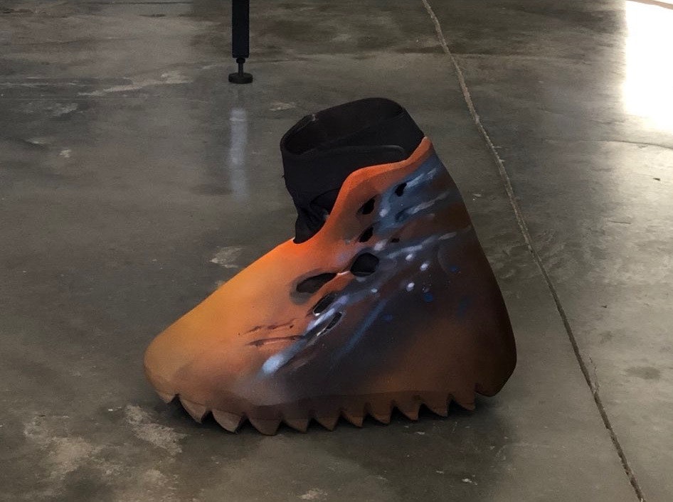 Kanye West shows off a Yeezy sneaker 