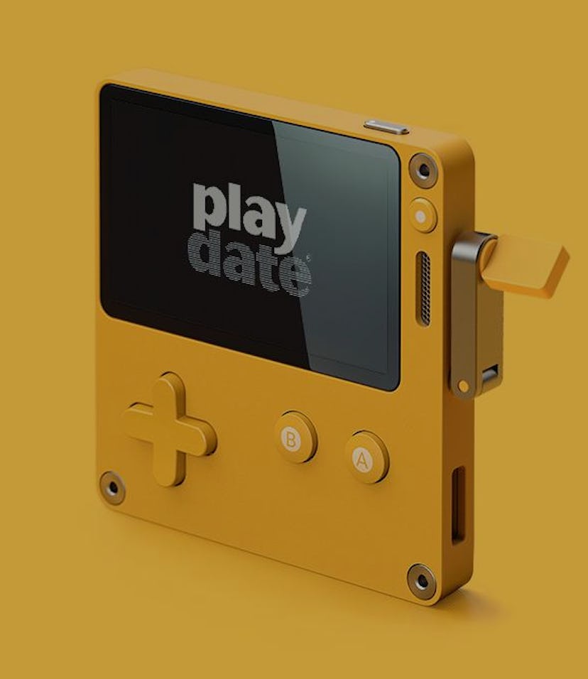 A photo of the Panic Playdate handheld game console.