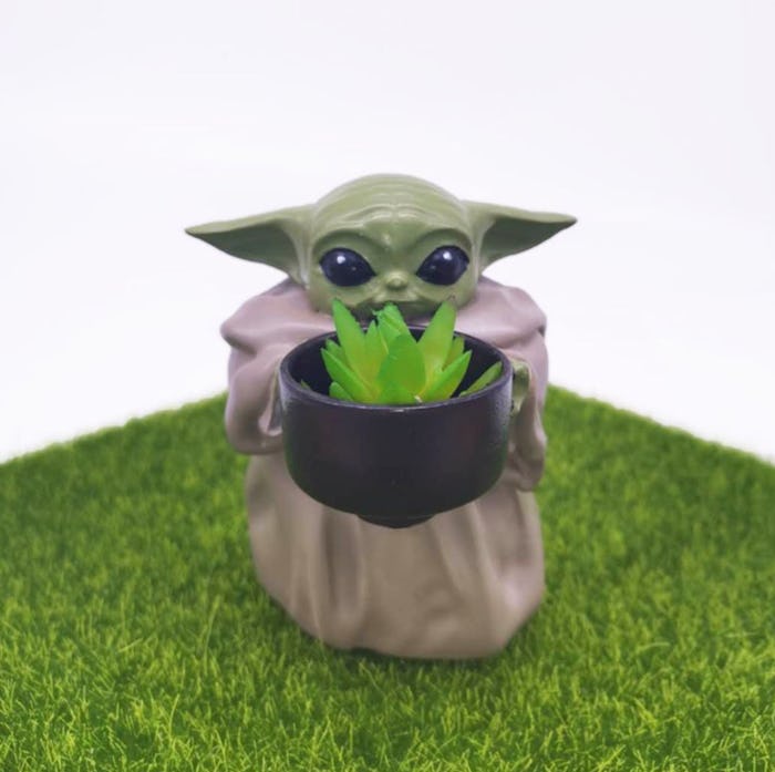 This mini Baby Yoda pot planter will take your fandom to the next level. 