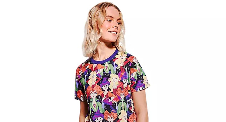 A woman wears a 'Hocus Pocus' shirt from the 2020 Halloween Disney collection.