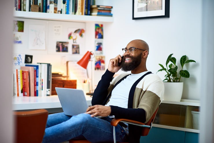 Cheerful business man working from home.