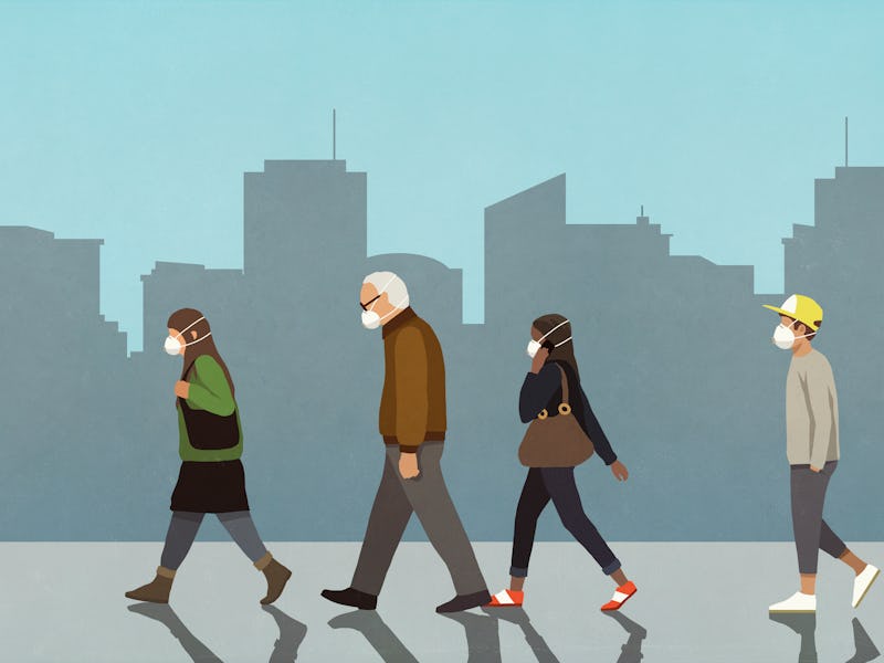 People on the street wearing masks.