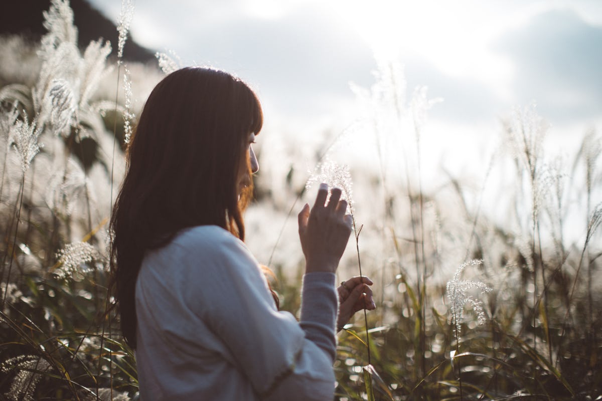 A woman touching the pampus grass