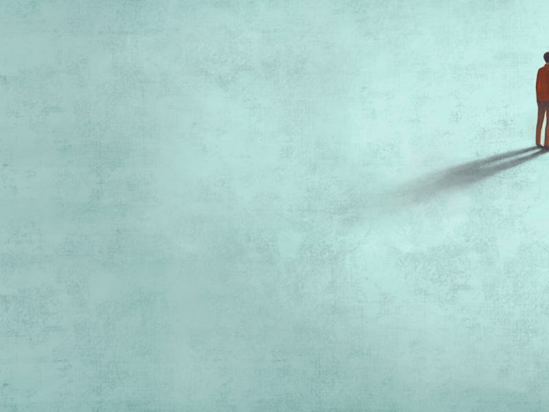 Man alone in a blue space.