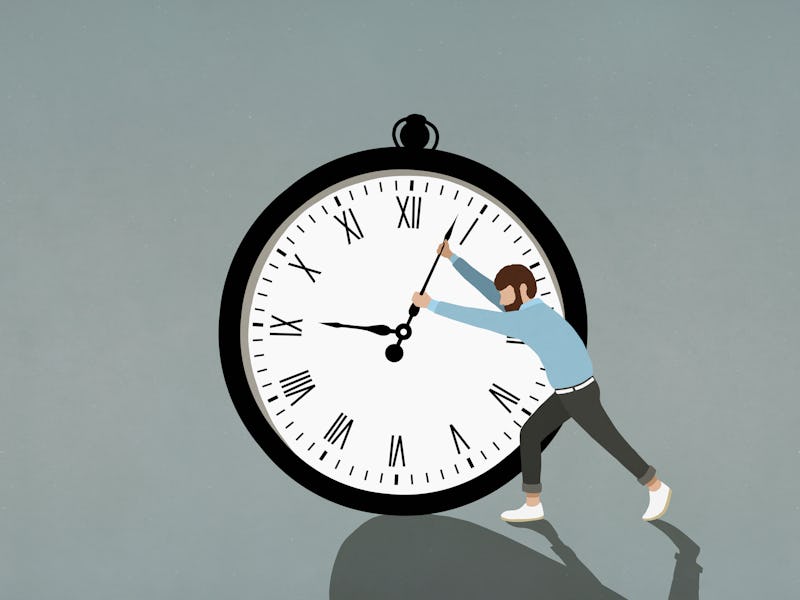 Man pushing hands of large clock.