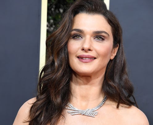 Rachel Weisz on the red carpet wearing an off-the-shoulder dress with a diamond necklace