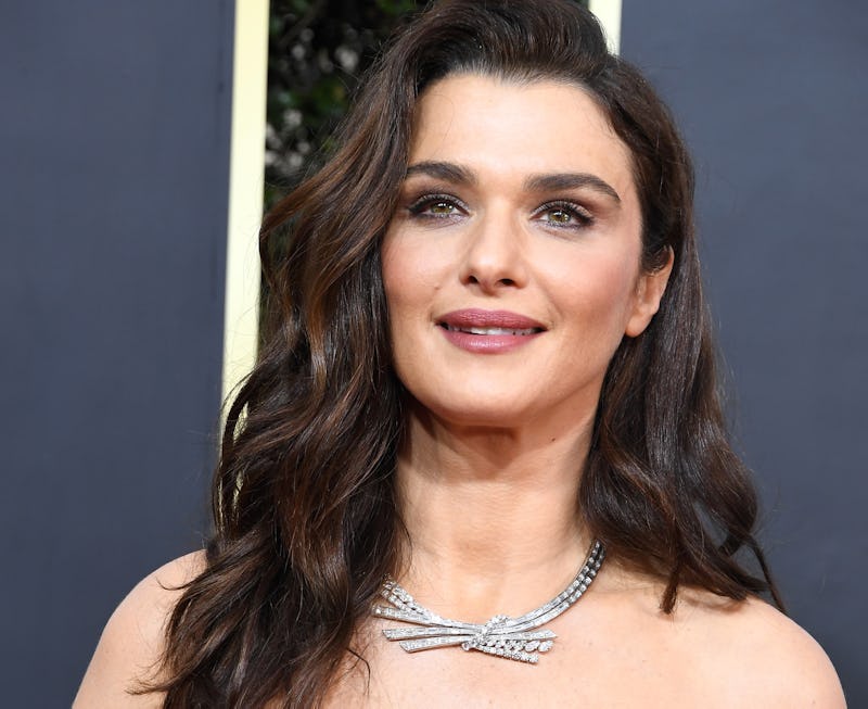 Rachel Weisz on the red carpet wearing an off-the-shoulder dress with a diamond necklace