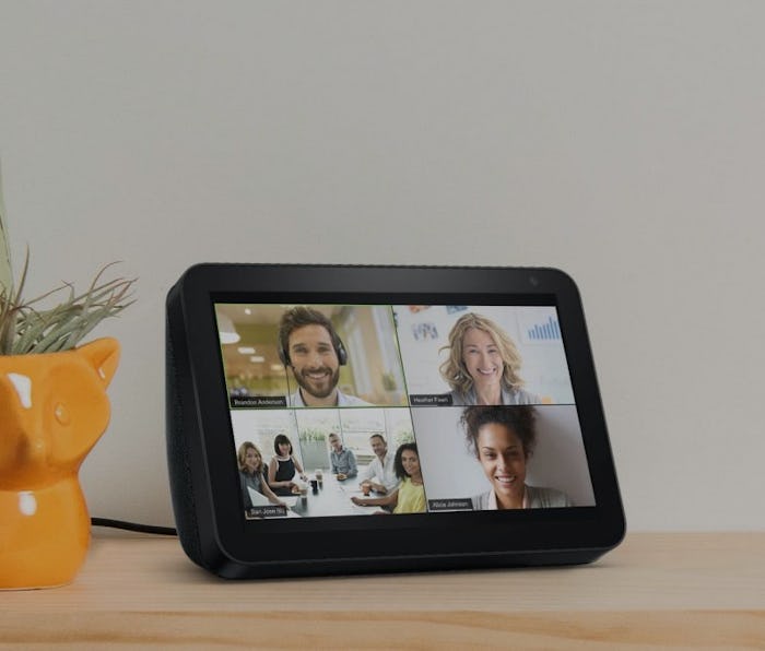 Four people video-conference on an Amazon Echo Show device.