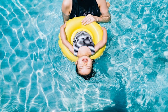 When is labor day 2020? Mom and toddler girl playing in swimming pool