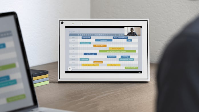 A video chat bubble is shown in the upper-right corner of a Facebook Portal device, with a calendar ...