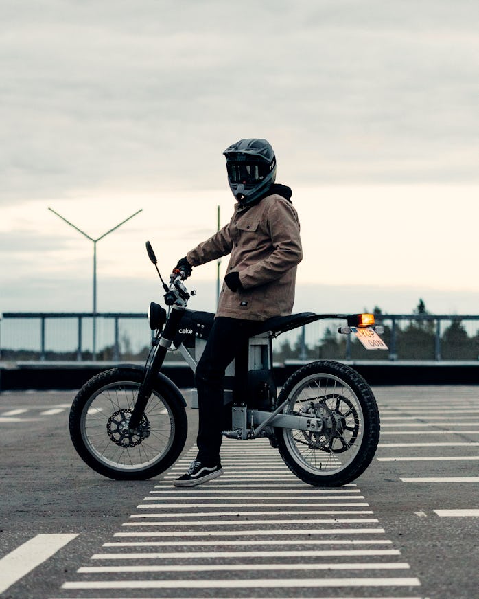 A Cake Ink SL electric motorcycle with a rider