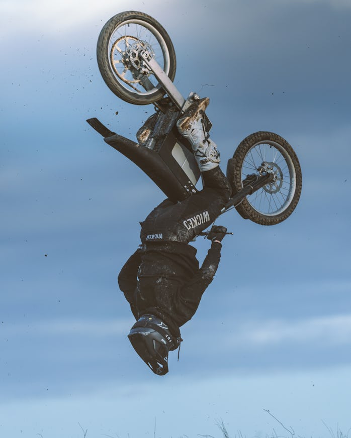 A Cake Kalk Ink electric motorcycle mid backflip