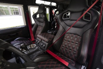 The driver and passenger seats in an electric Defender.
