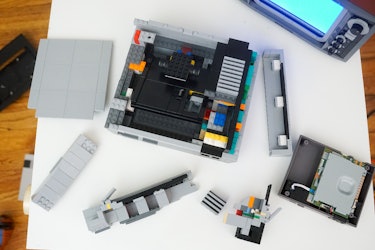 Carefully remove the pieces that make up the walls of the Lego NES to allow you to yank out the cart...