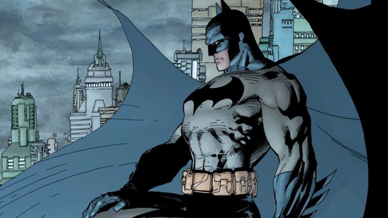 The comic book illustrated version of the Batman watching over Gotham